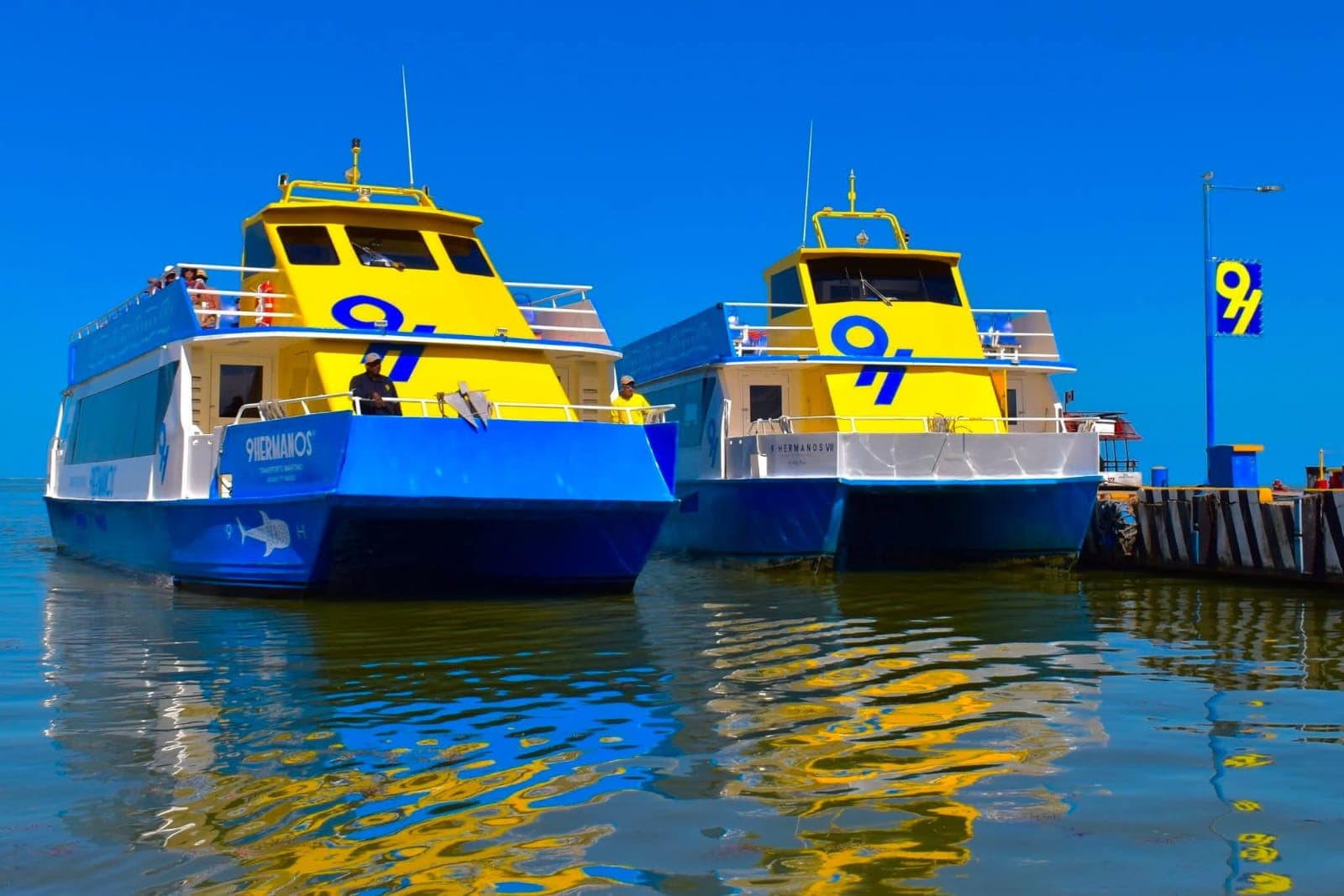 9 Hermanos and Holbox Express ferries docked at Puerto Chiquilá